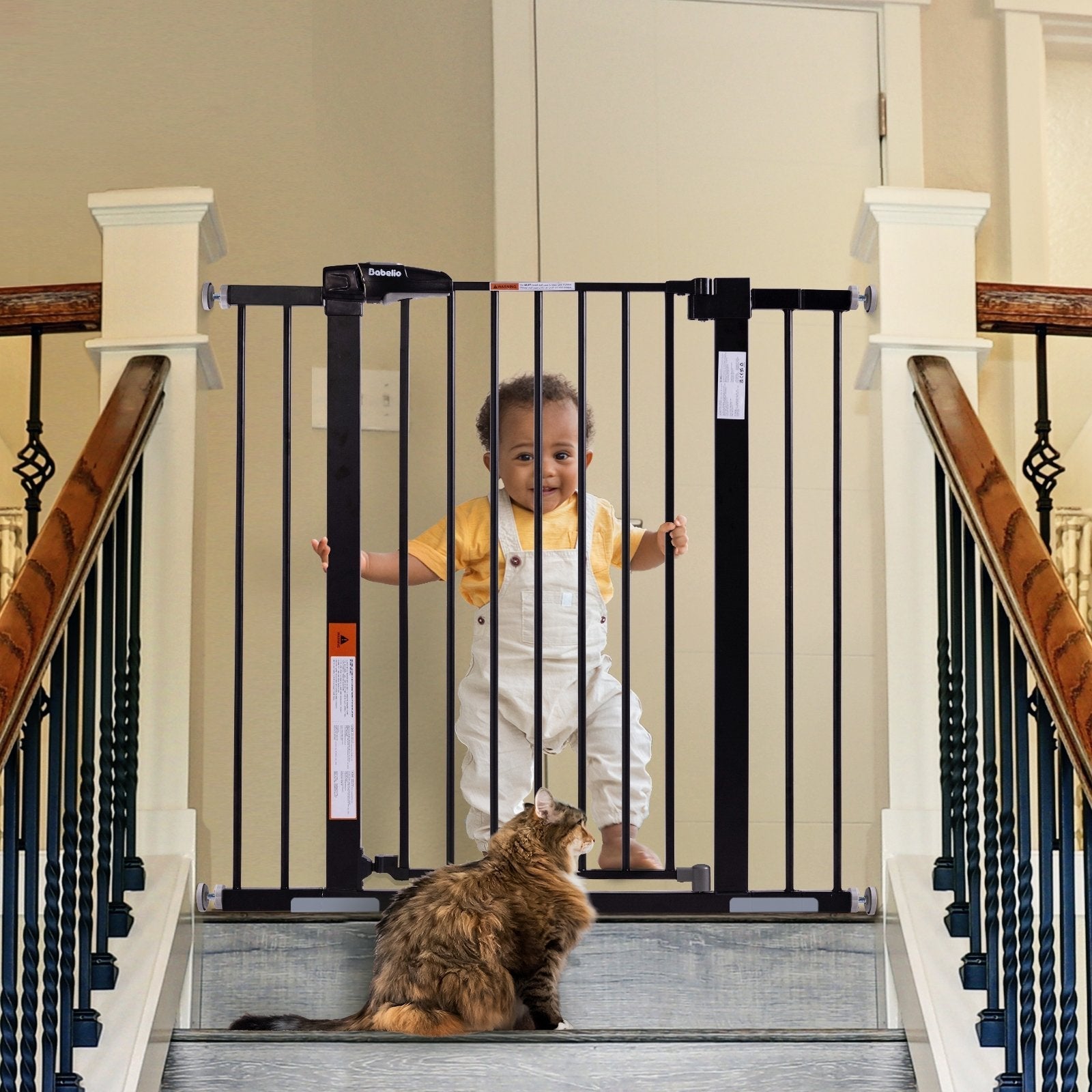 Babelio baby safety gate at top of stairs in home with child and cat, secure stairway barrier.