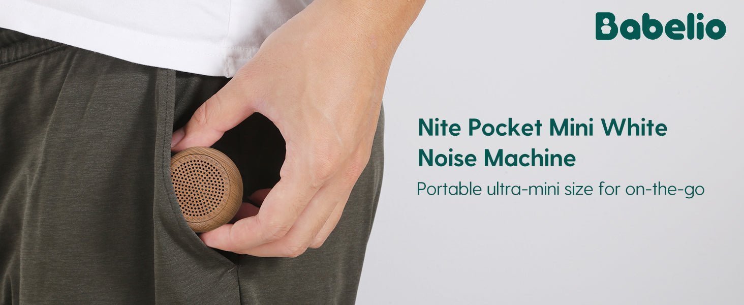 Babelio portable Nite Pocket Mini White Noise Machine in hand, fits in pants pocket.