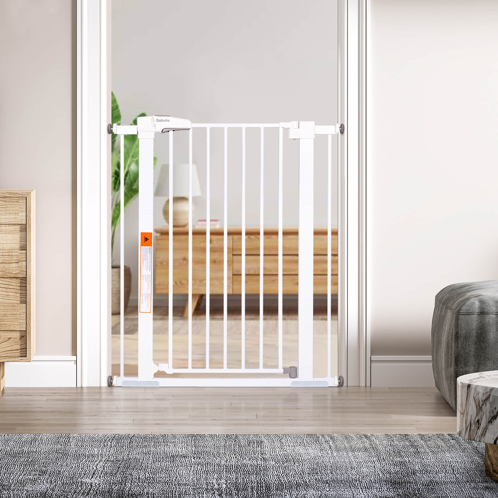 Babelio baby safety gate installed in a modern living room doorway with wood furniture