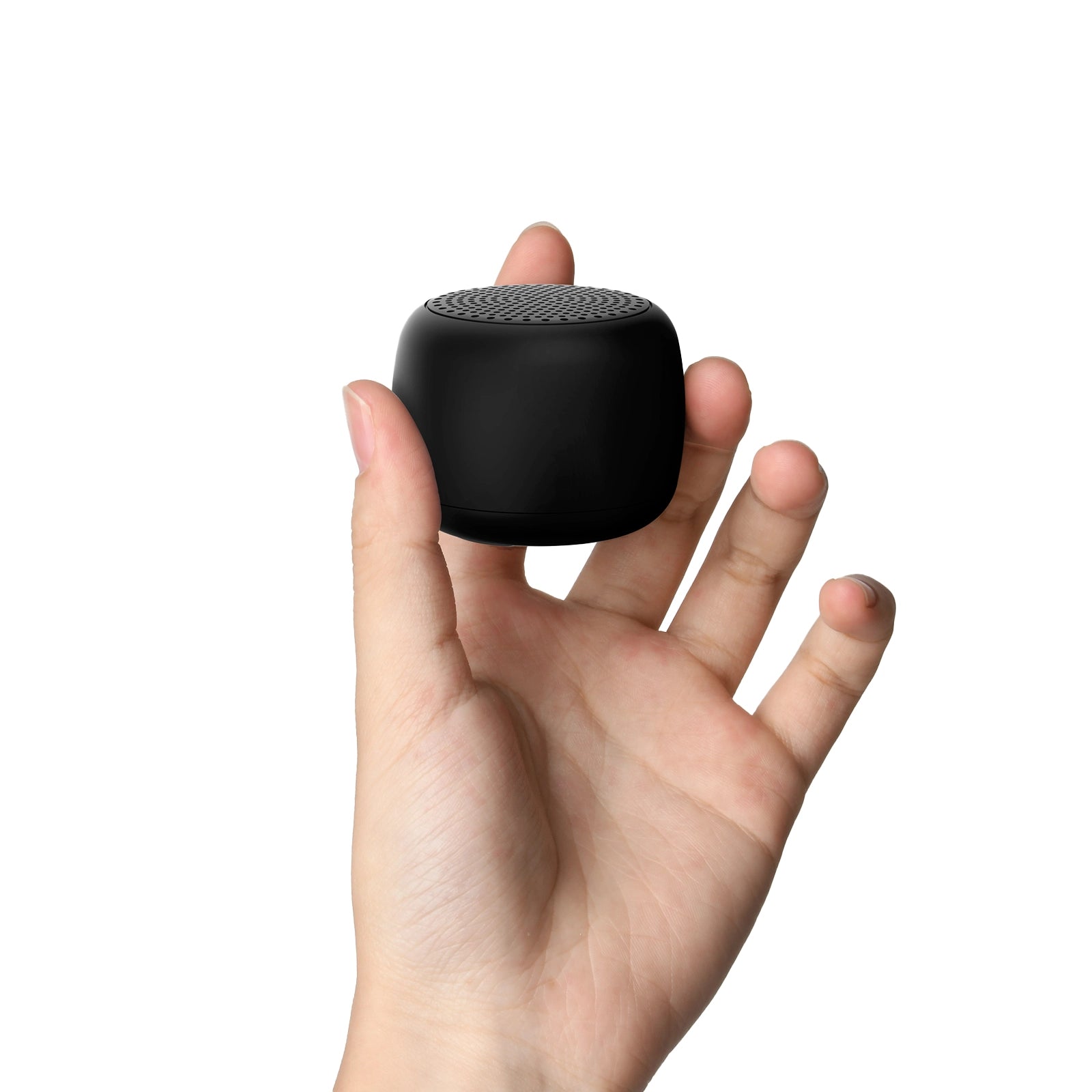 Hand holding a compact black Babelio white noise machine for babies