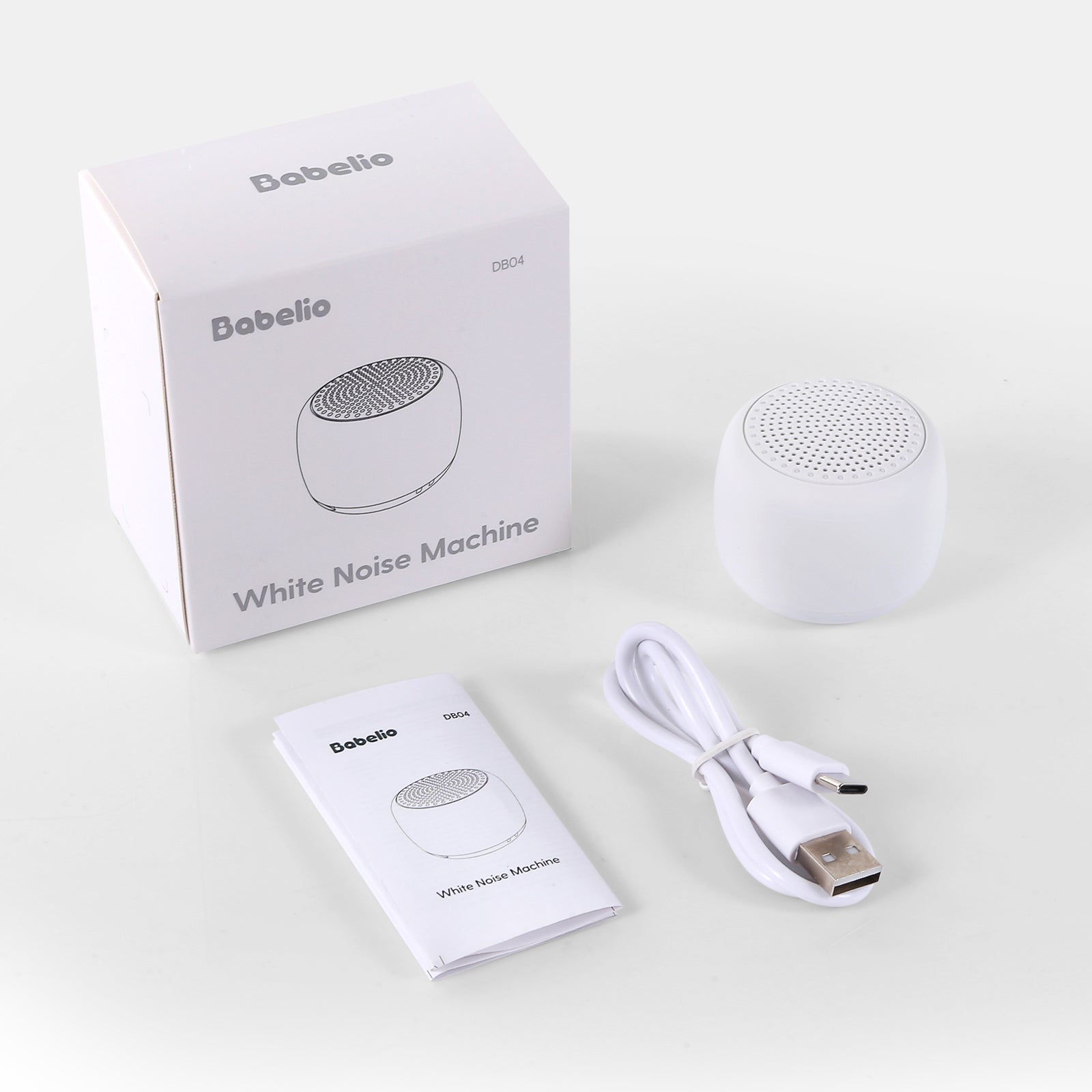 Babelio white noise machine with box, USB cable, and manual on white background