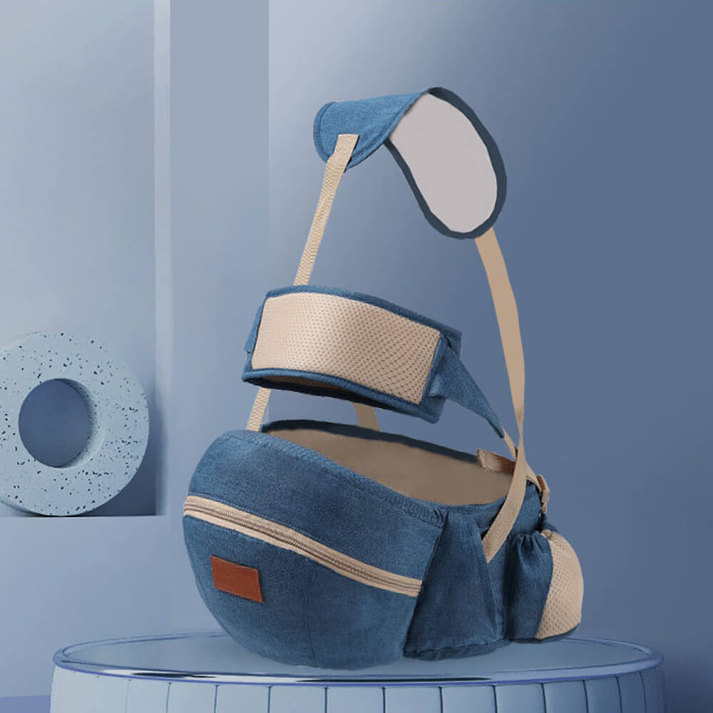 Babelio blue infant carrier waist stool with beige straps displayed in a modern nursery