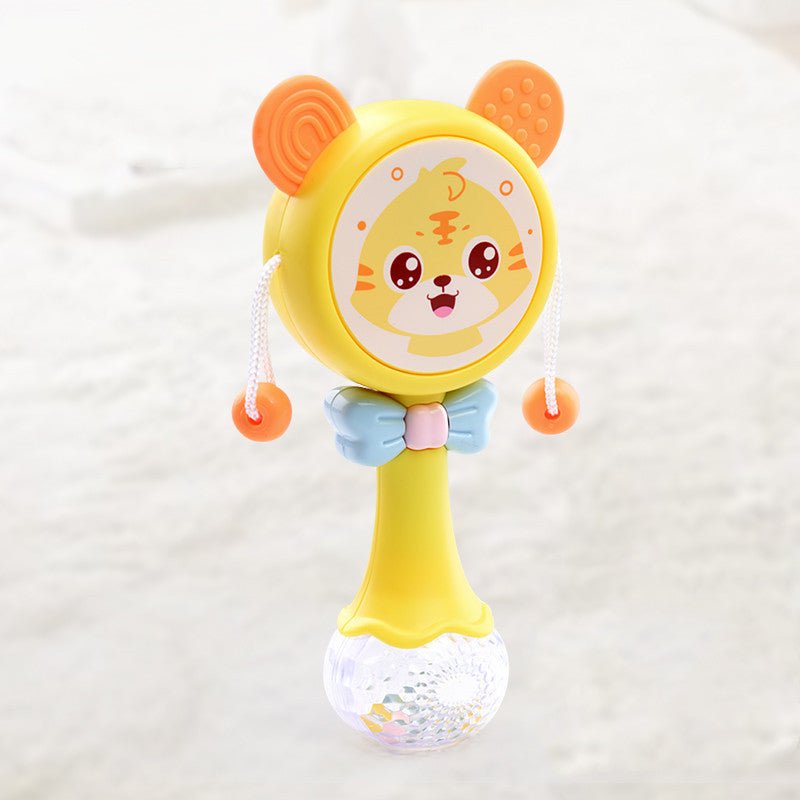 Babelio yellow baby rattle toy with tiger face and blue bow in a nursery setting