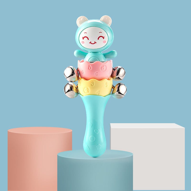 Babelio colorful baby rattle toy with bells, displayed on pastel podiums in a studio setting.