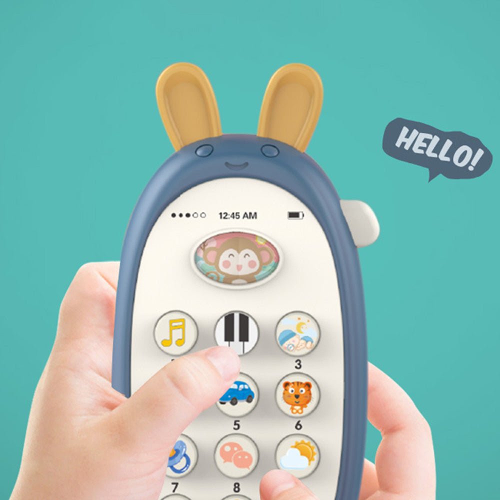 Babelio baby white noise machine with animal buttons, held in a child's hand, teal background