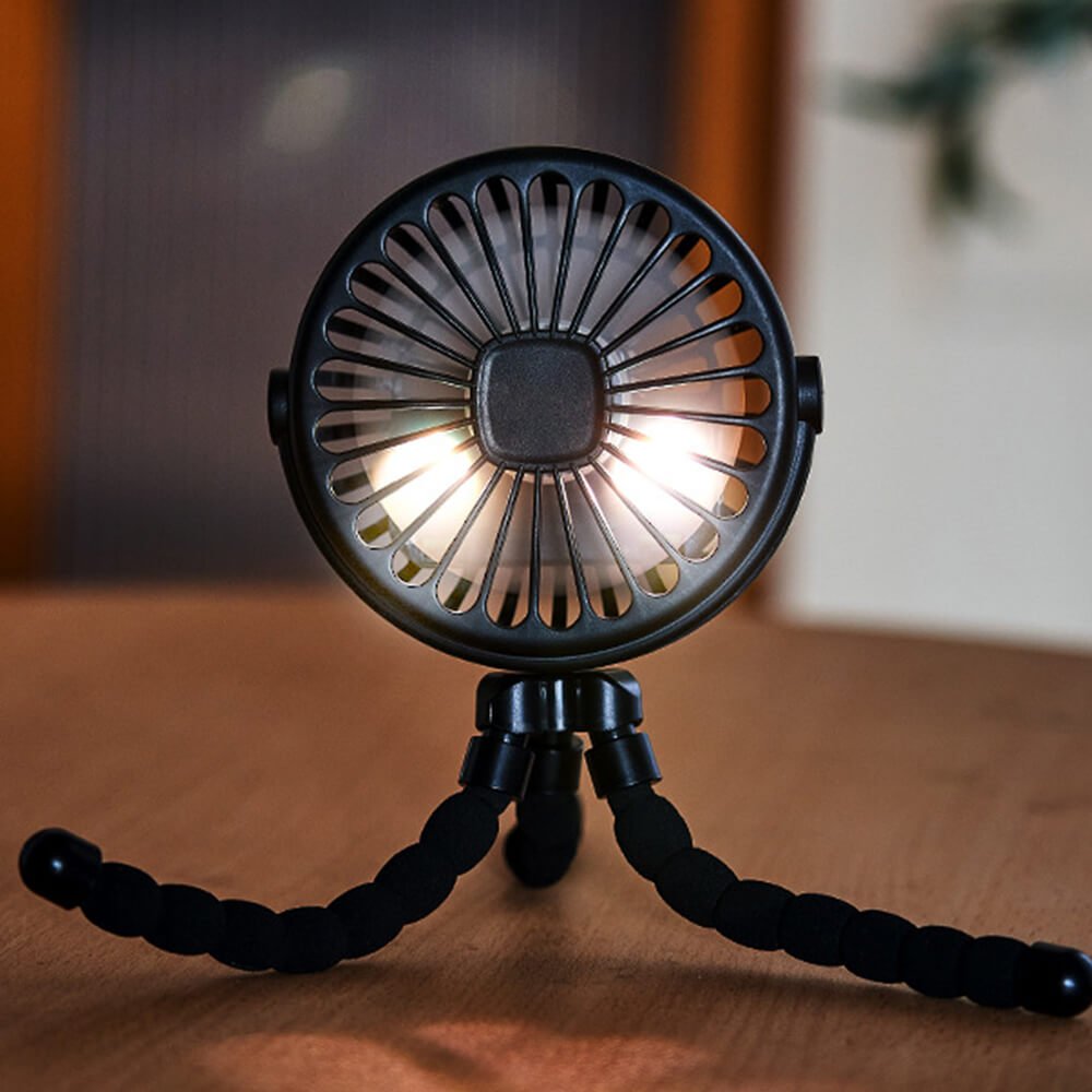 Babelio portable stroller fan with night light on a wooden table in a modern room