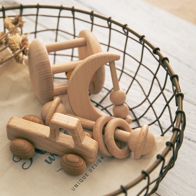 Babelio wooden baby toys in a wire basket on a nursery table