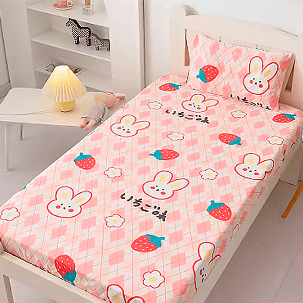 Babelio crib mattress with pink cartoon bunny and strawberry print in a nursery setting