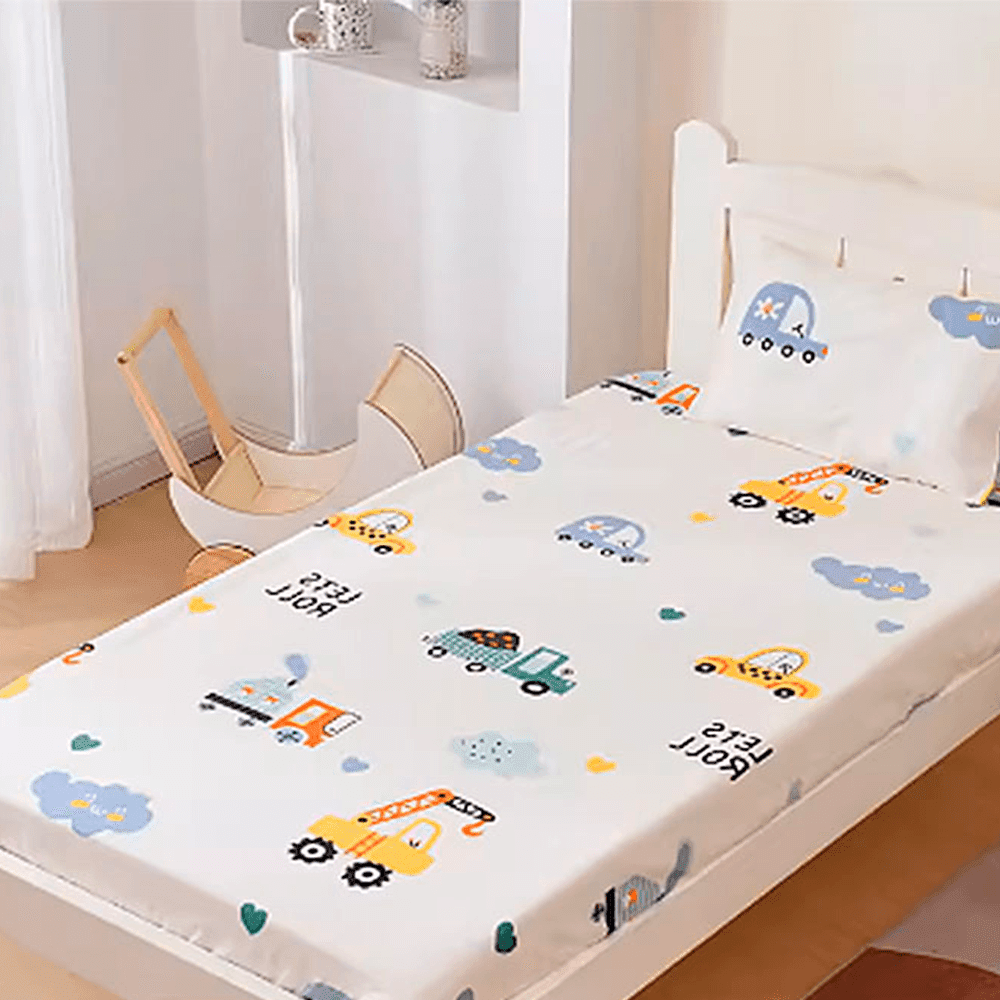 Babelio crib mattress in nursery with playful cartoon car print bedding