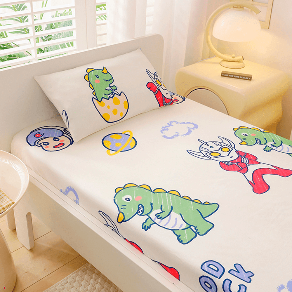 Babelio crib mattress with playful cartoon pattern bedding in a bright nursery