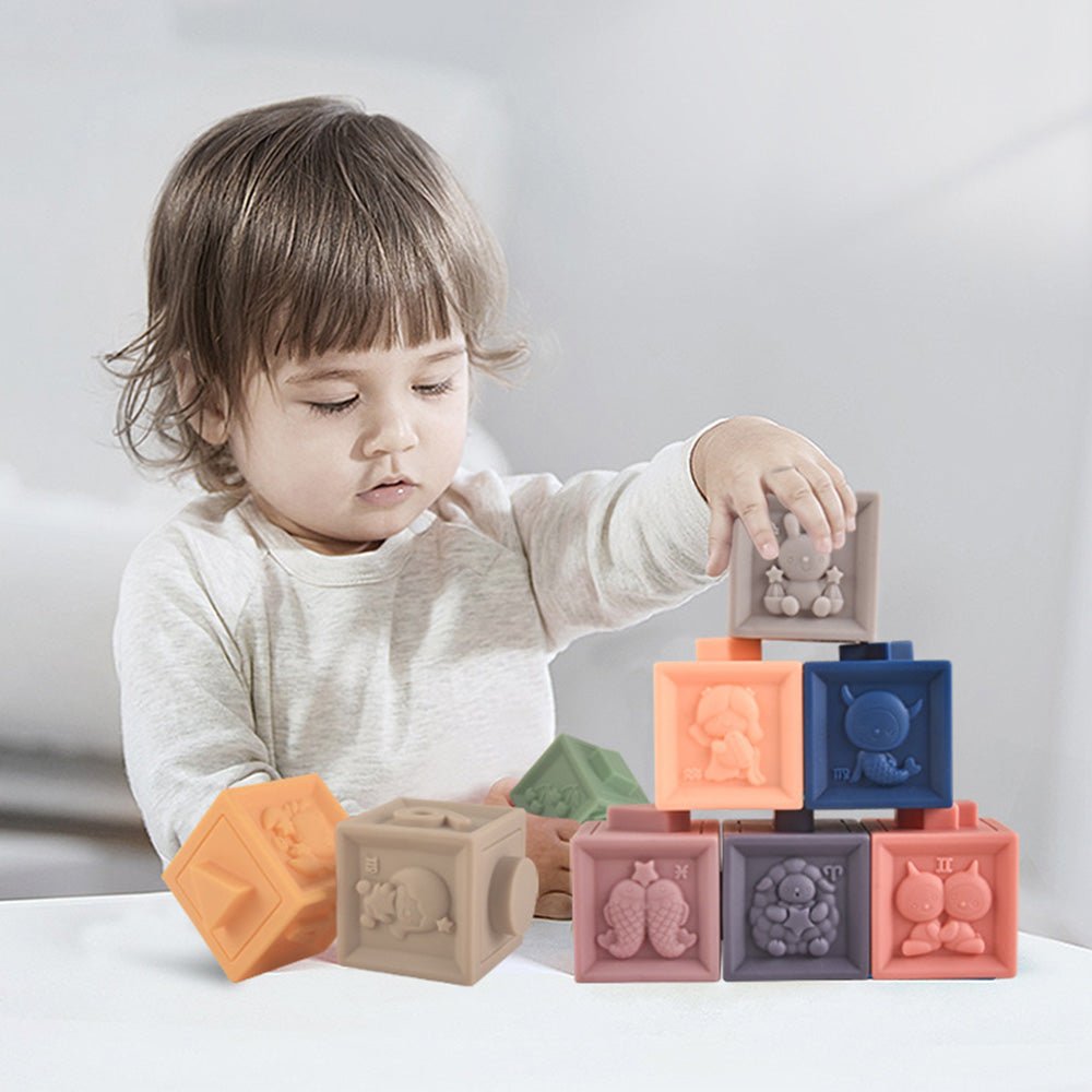 Toddler playing with colorful Babelio sensory blocks in a modern nursery setting