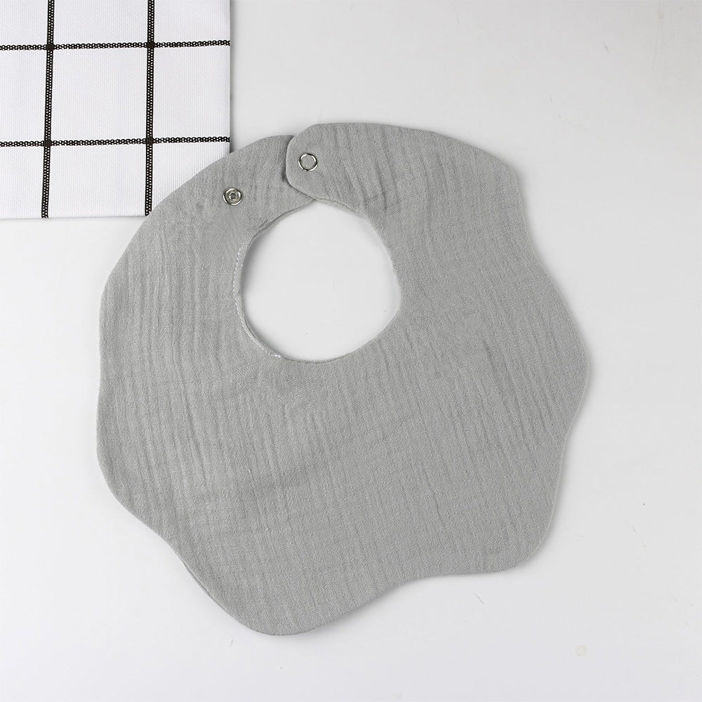 Babelio solid gray baby bib on white surface, modern nursery accessory