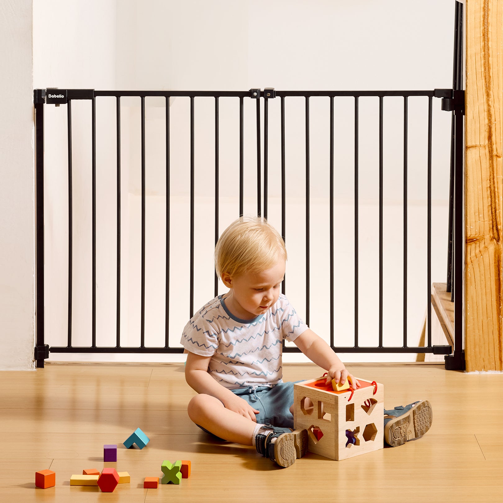 A hardware-mounted baby safety gate featuring a no-bottom-bar design that allows smooth, trip-free passage and secure separation for babies and pets. Ideal for stairs, doorways, and play areas in modern homes, from the Boundless R30 series by Babelio.