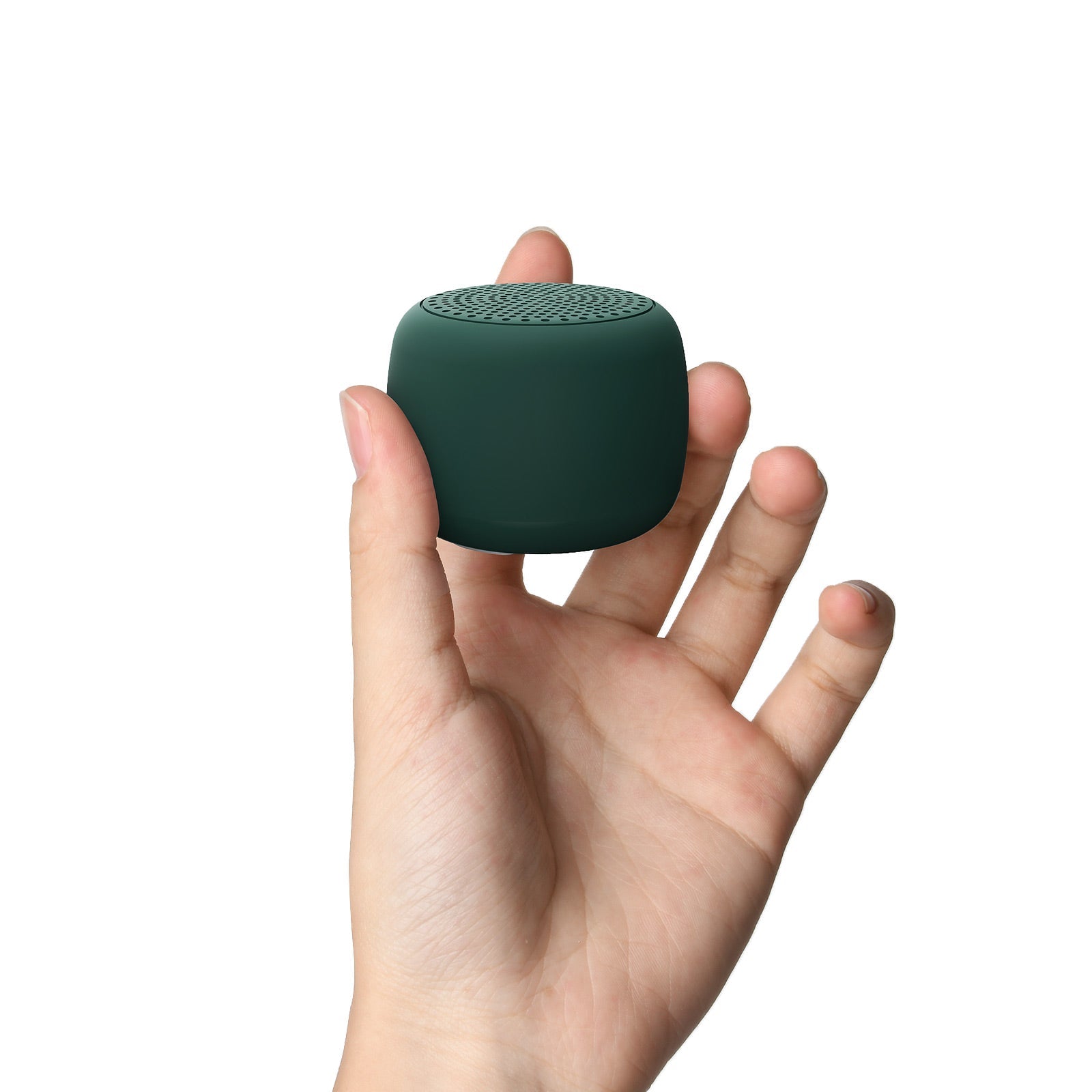 Hand holding Babelio mini white noise machine for babies and kids against white background