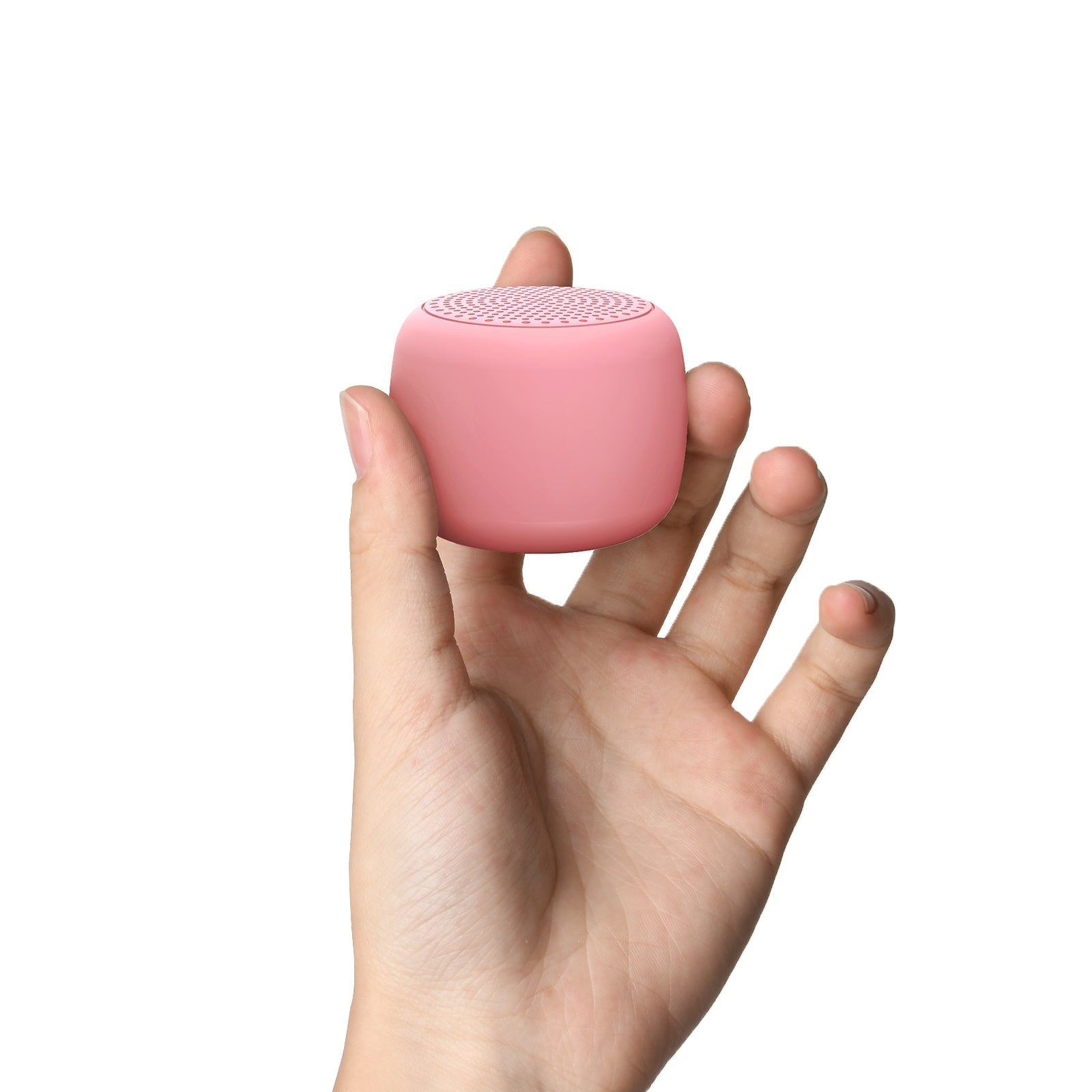 Hand holding a pink Babelio white noise machine, compact sound device for travel or nursery.