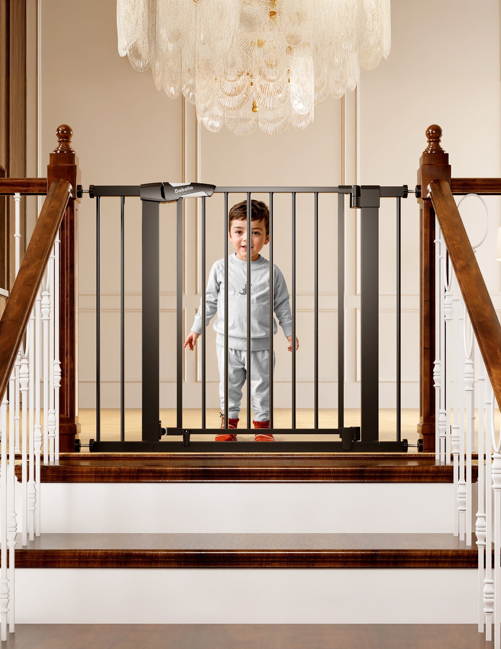 Babelio baby safety gate installed on staircase with toddler in elegant hallway