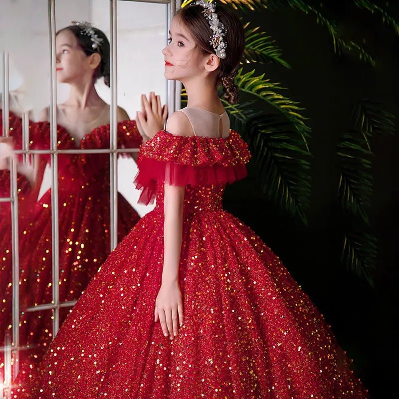 Young girl in an elegant red sequin ball gown with headband, Babelio