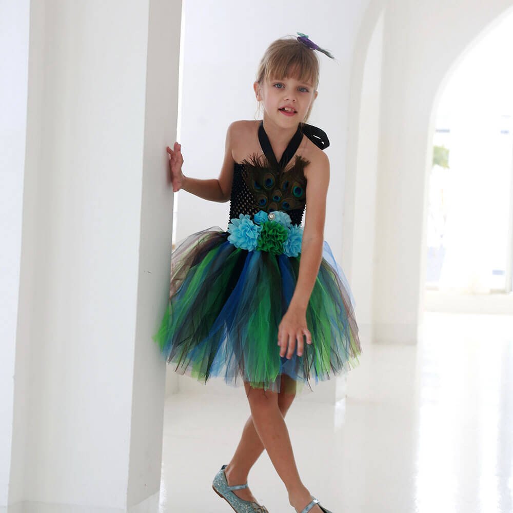 Babelio kids peacock tutu dress with blue and green tulle, modeled in bright indoor setting