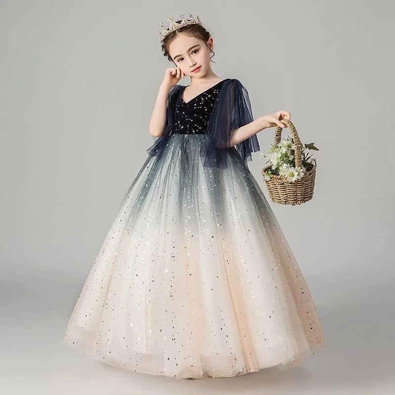 Babelio girl in tulle sequin princess dress with crown holding basket, studio background