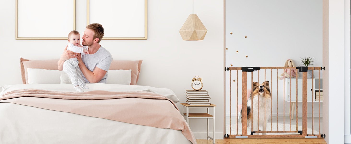 Father holding baby on bed near nursery with Babelio baby safety gate and dog