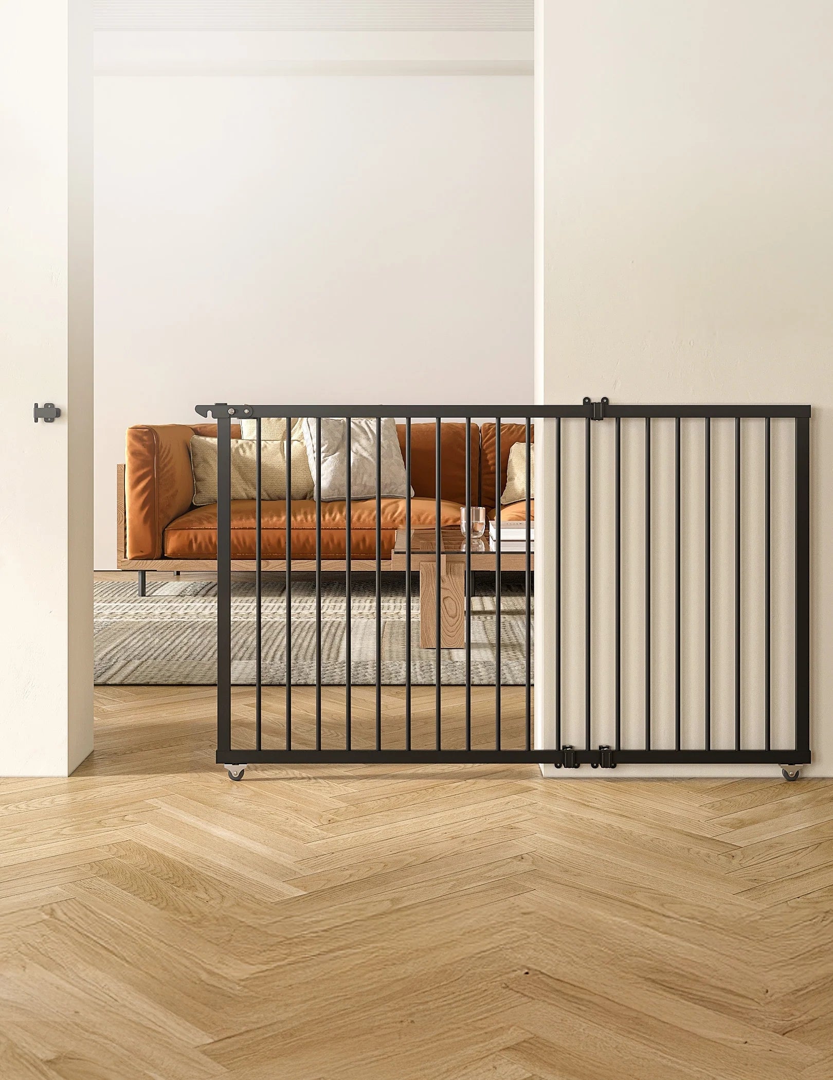 Babelio baby safety gate installed in a modern living room with wooden floors and a brown sofa.