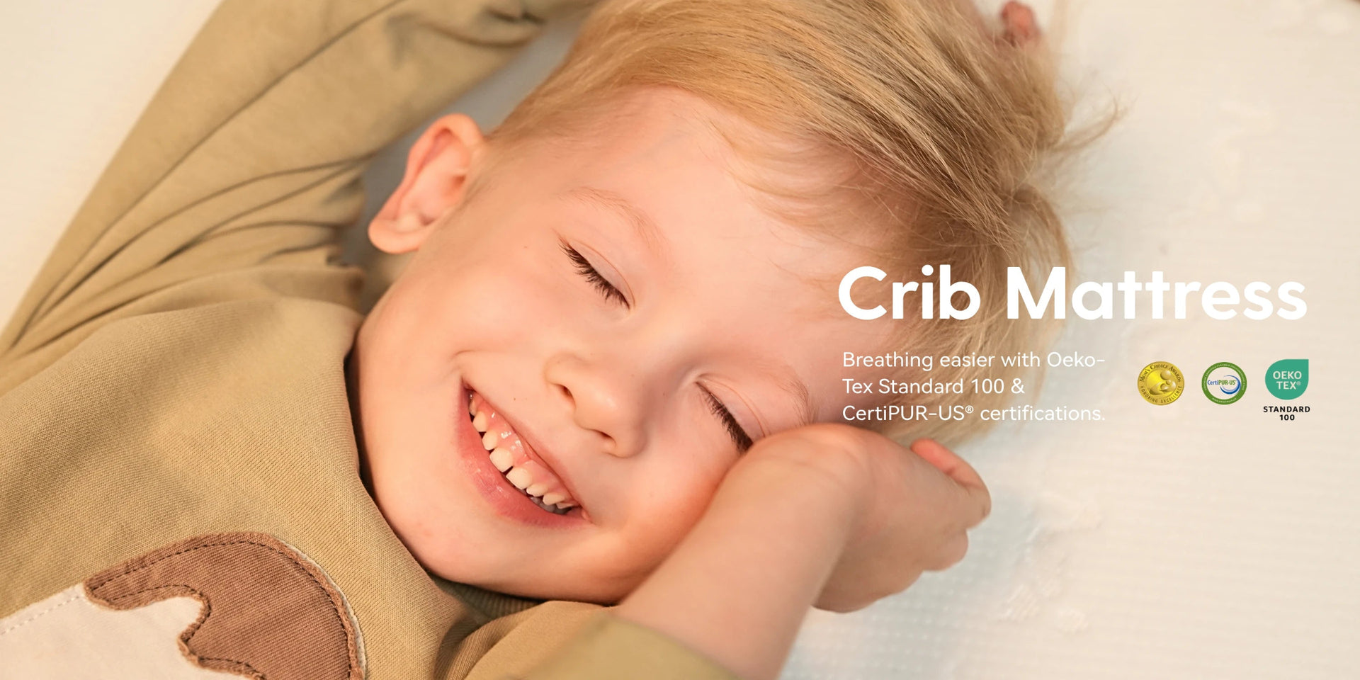 Child lying on a crib mattress with text about crib mattress features.