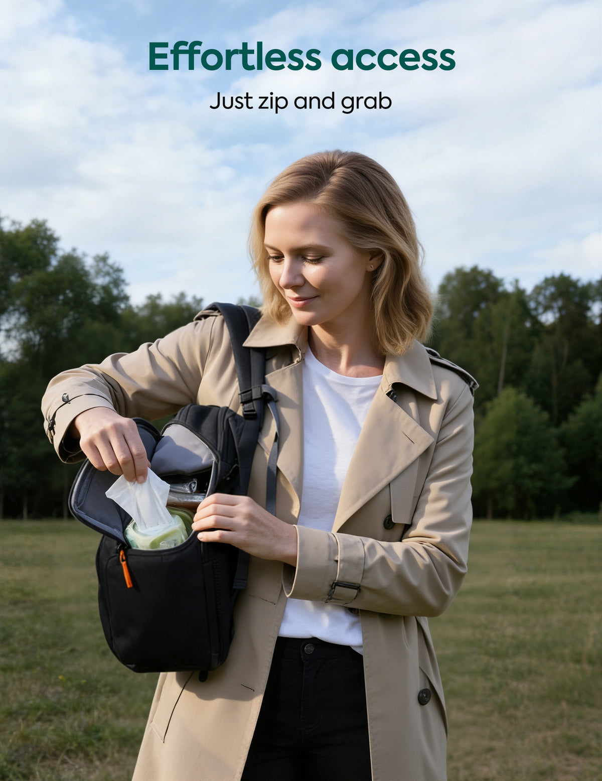 Woman in a beige coat opening a black backpack outdoors with text 'Effortless Access' and 'Just Zip and Grab'.
#Color_Black