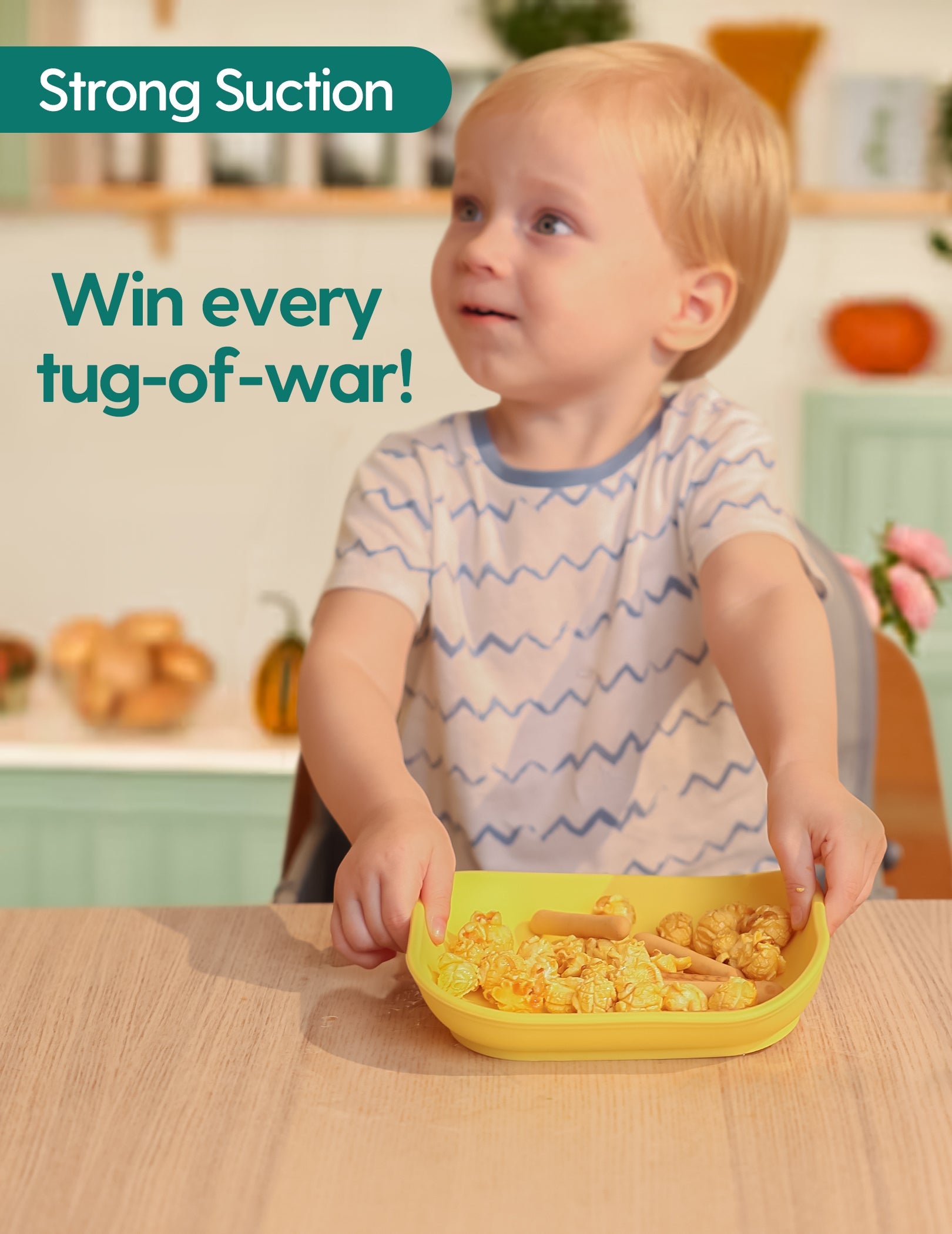 Babelio toddler using strong suction bowl in kitchen, modern baby feeding accessory