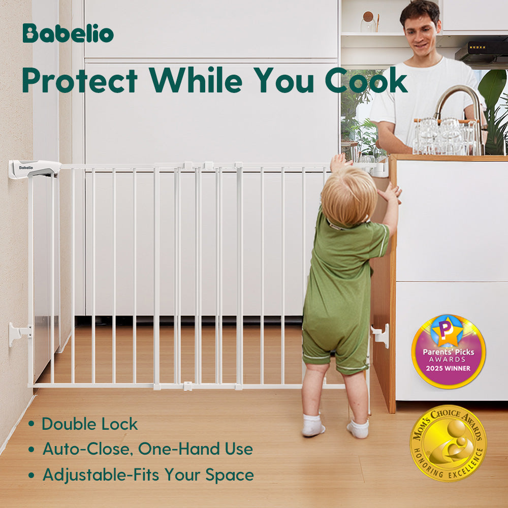 A toddler standing in front of an adjustable baby gate used for kitchen safety while a parent cooks, featuring auto close, double lock, and no bottom bar sturdy drill-mounted design, Babelio Boundless B17