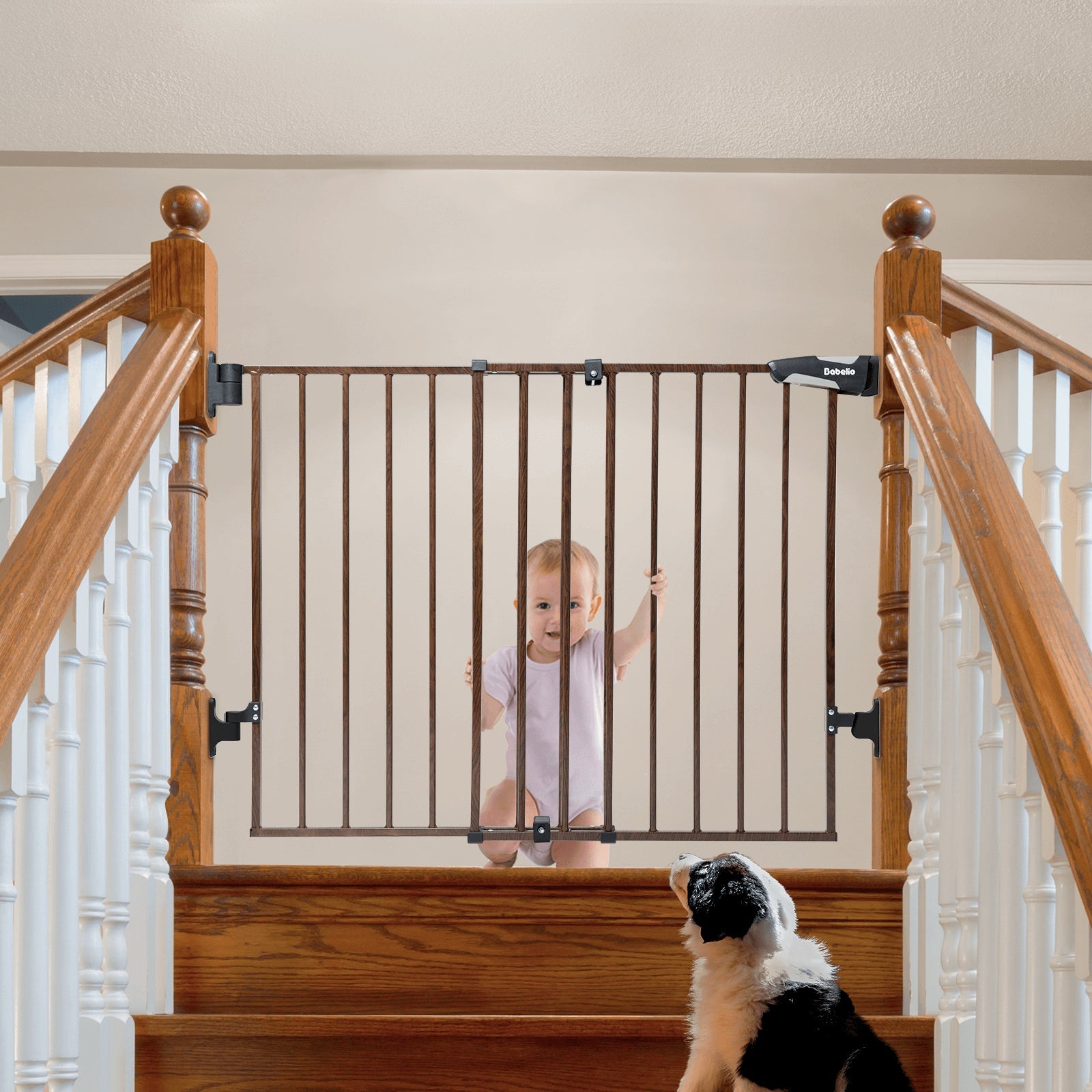 Babelio baby safety gate with wood pattern installed on staircase, baby and dog visible