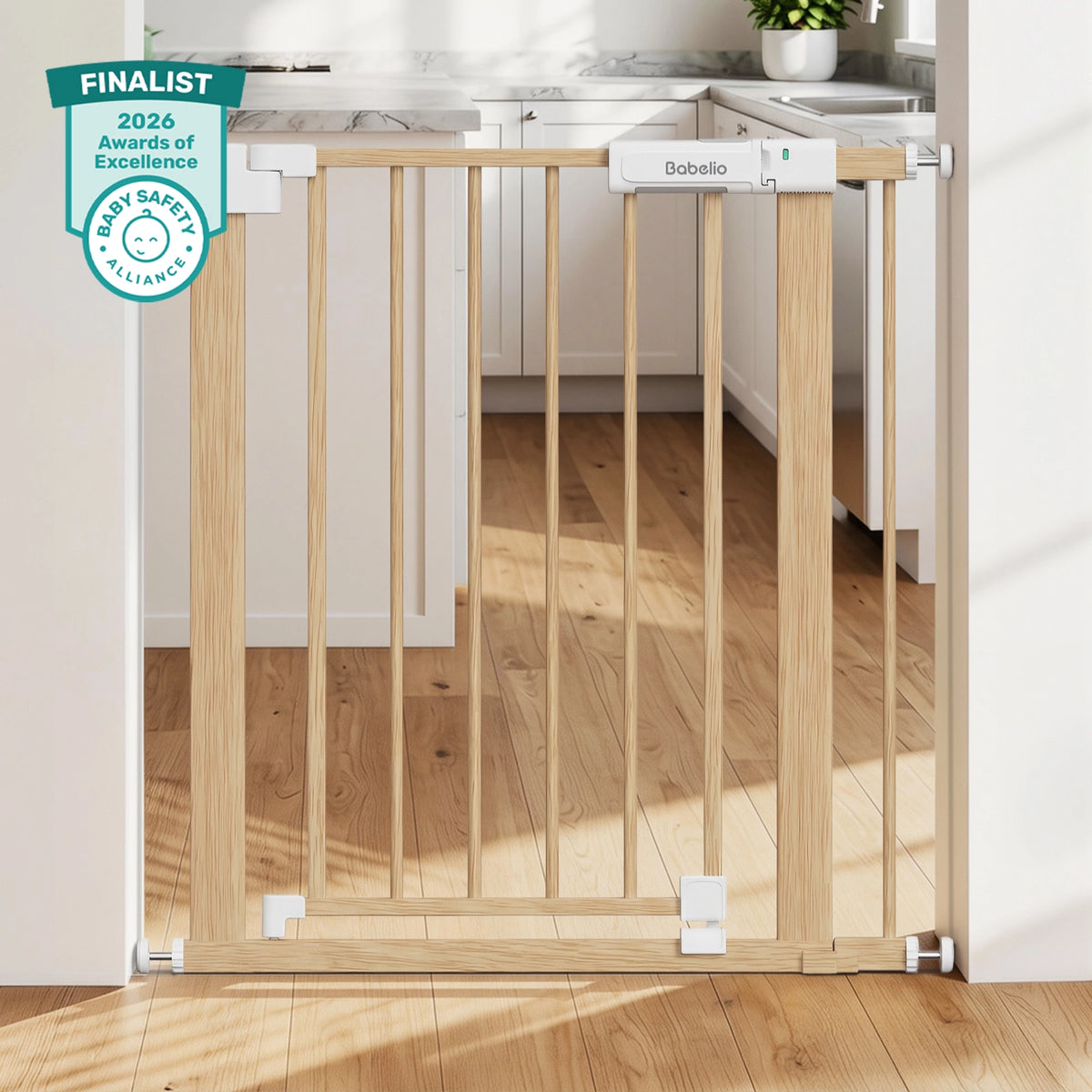 A light natural wood baby safety gate installed across a doorway in a bright kitchen. The gate has white plastic hardware connectors and a white brand label reading 'Bebolo' near the top.#Color_Light Wood Pattern