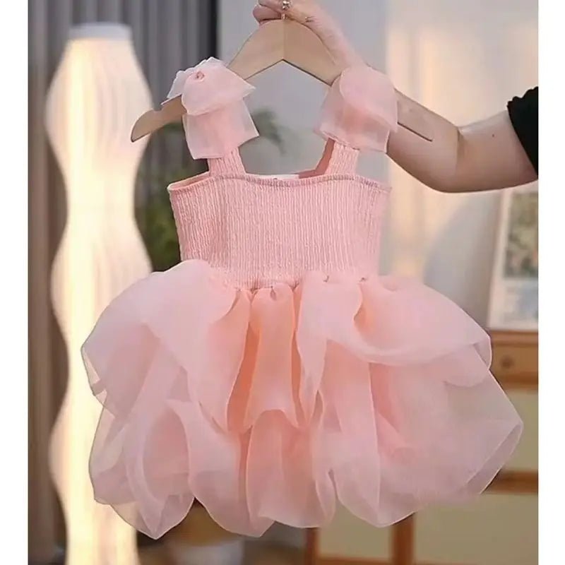 Babelio pink toddler princess dress with fluffy tulle, displayed in a cozy indoor room