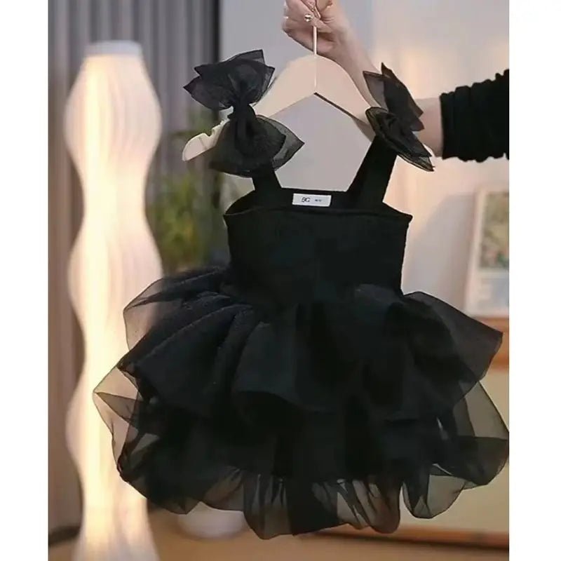 Babelio black toddler princess dress with ruffled tulle, displayed in a modern bedroom