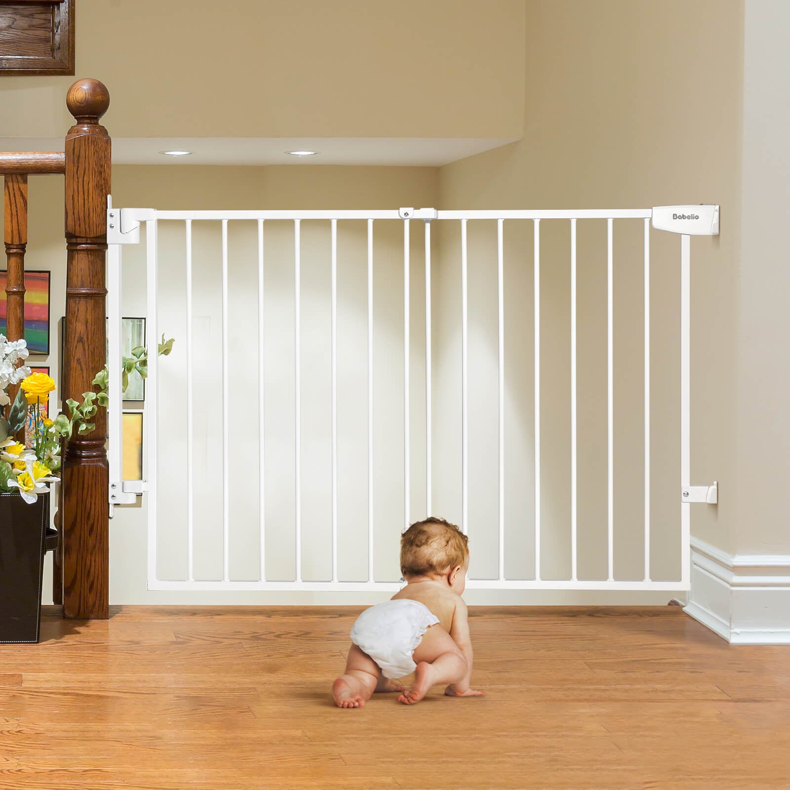 Hardware-mounted baby safety gate securely installed at the top of the stairs, creating a safe play area for infants and preventing falls, part of the Boundless S12 series by Babelio.