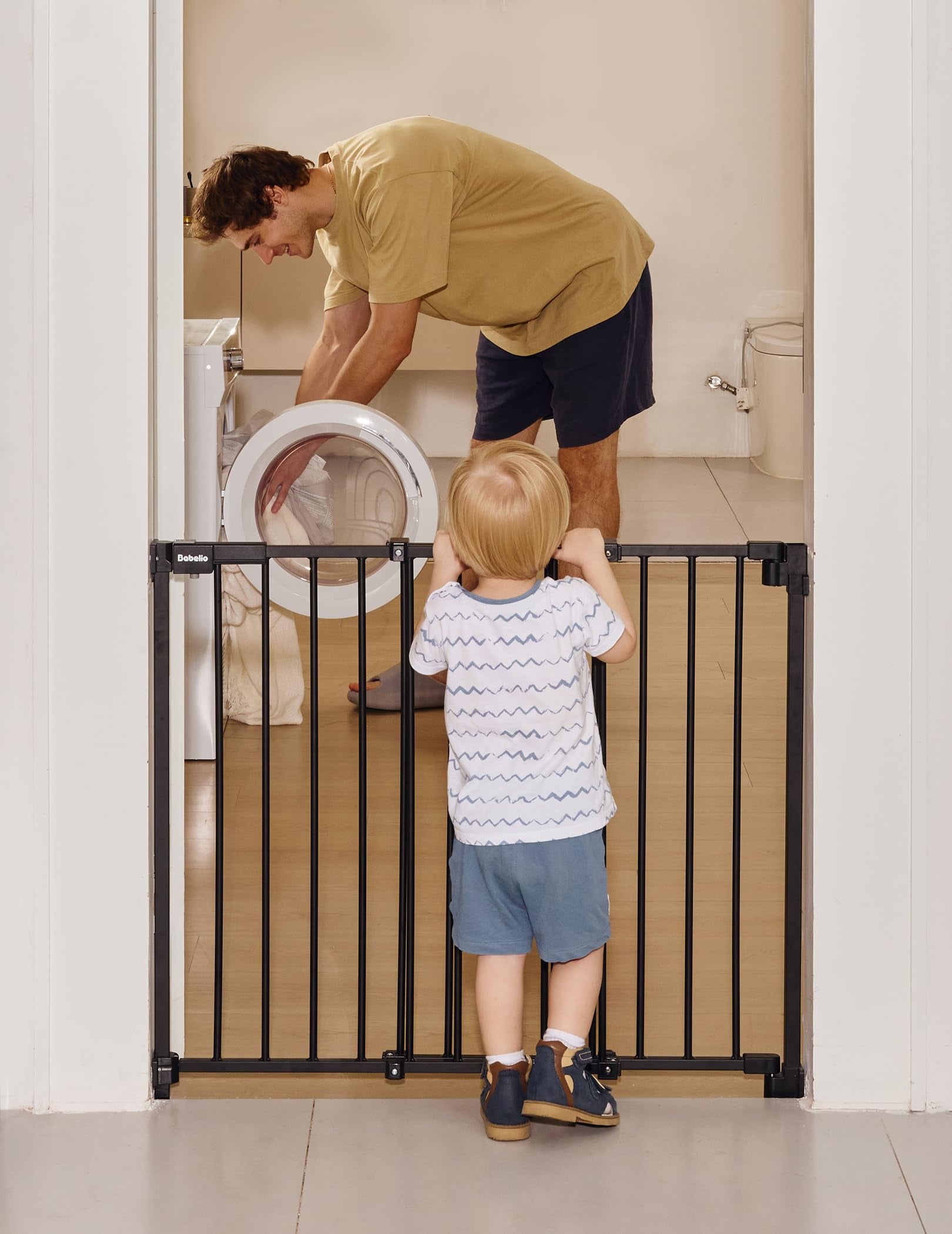 A hardware-mounted baby safety gate featuring a no-bottom-bar design for smooth, trip-free passage and reliable protection. Perfect for separating babies and pets in stairways, doorways, or laundry areas while keeping family interaction within sight, from the Boundless R30 series by Babelio.