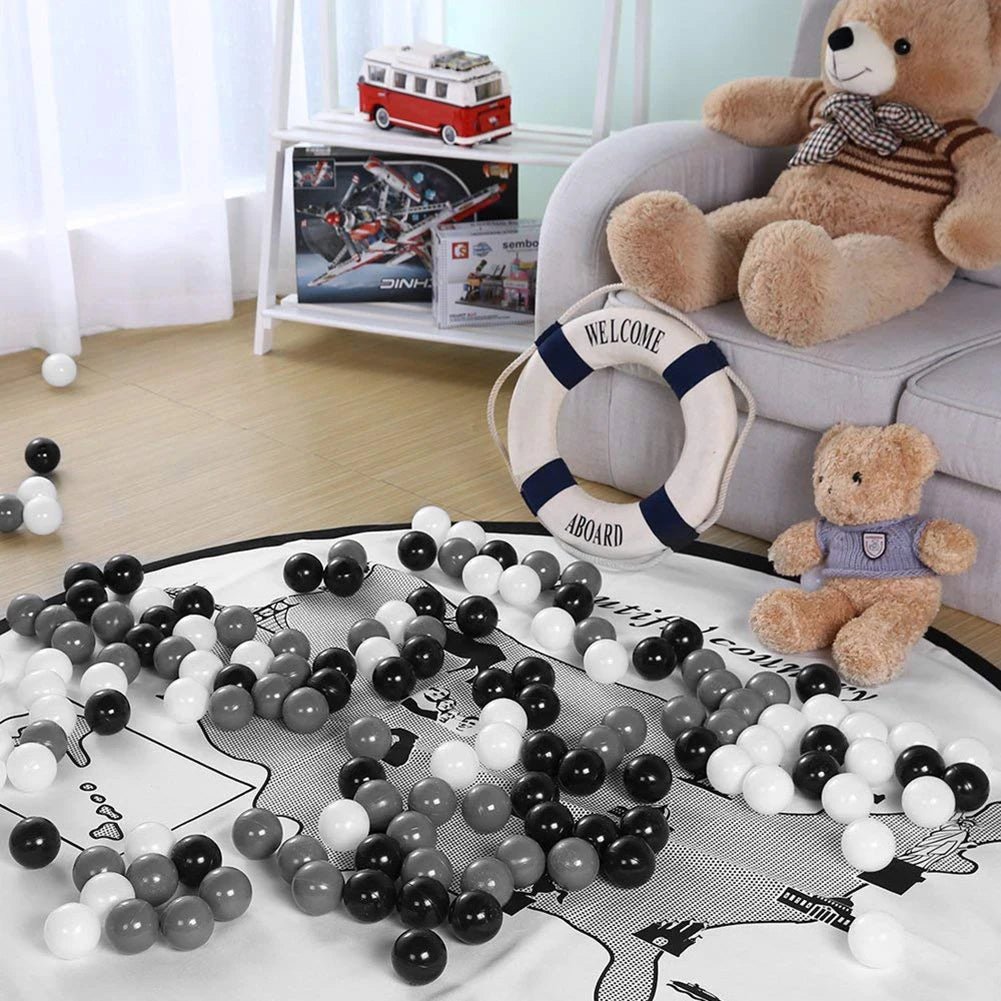Babelio nursery with plush teddy bears, play mat, and black, white, gray play balls