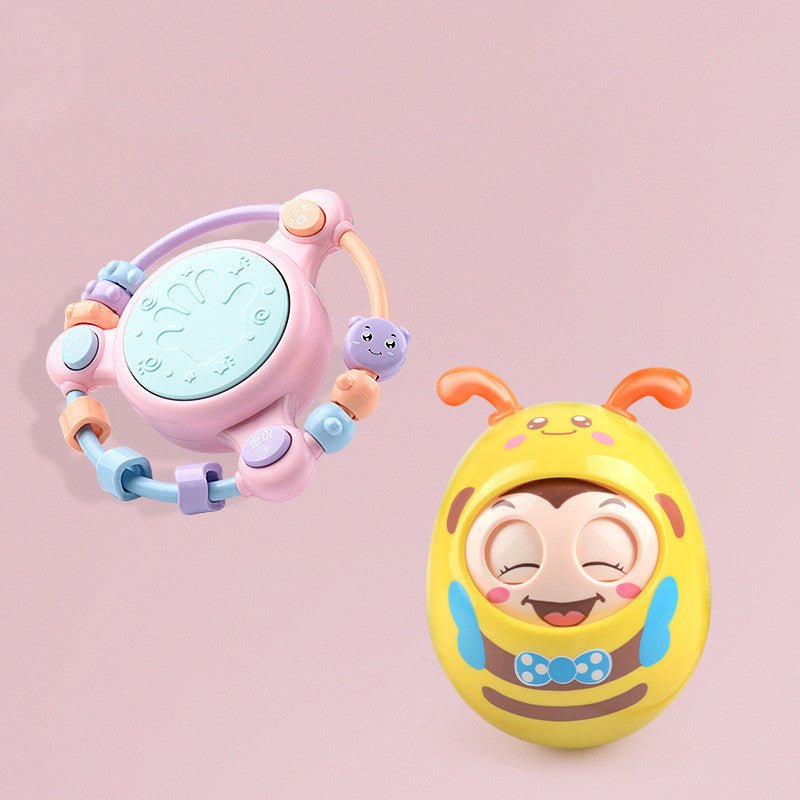 Babelio pastel baby rattle and yellow wobble toy on pink background