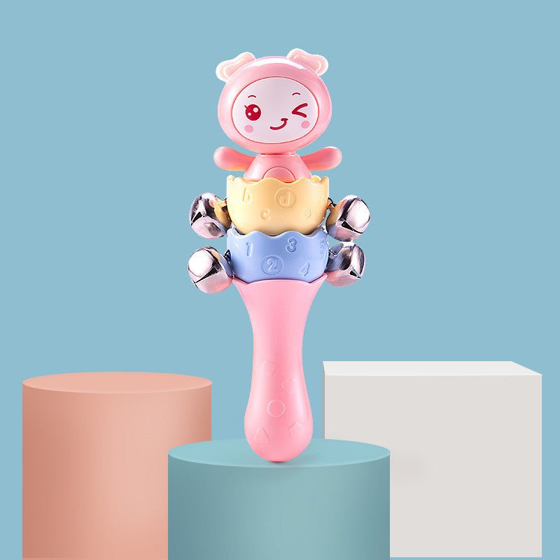 Babelio pastel baby rattle toy with animal face and bells on blue nursery background