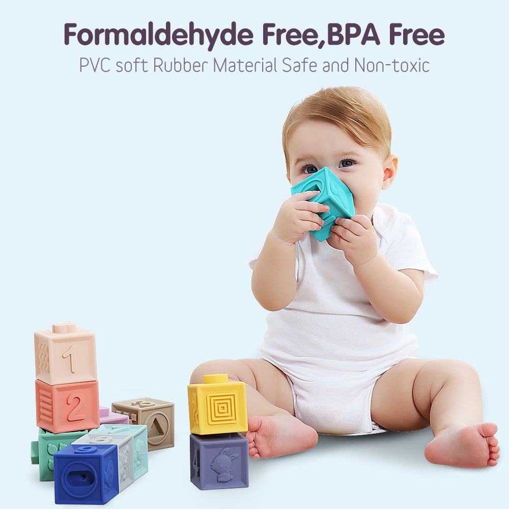 Babelio baby playing with colorful BPA-free rubber blocks on a nursery floor