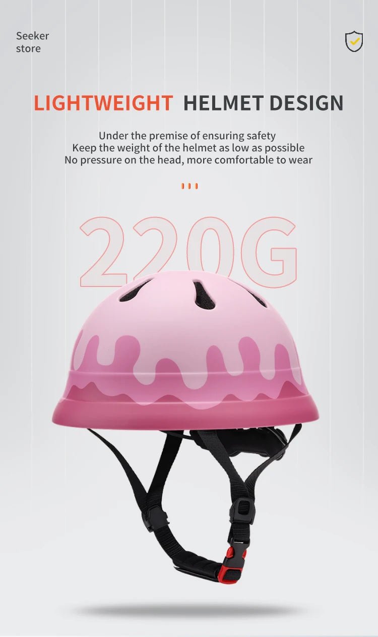 Babelio kids pink lightweight bike helmet with black straps on white background, breathable design.