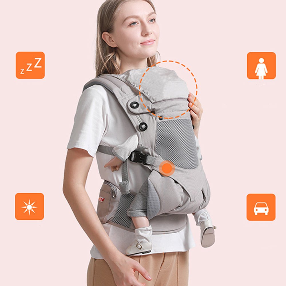 Babelio ergonomic baby carrier with hip seat, grey, worn by woman in indoor setting