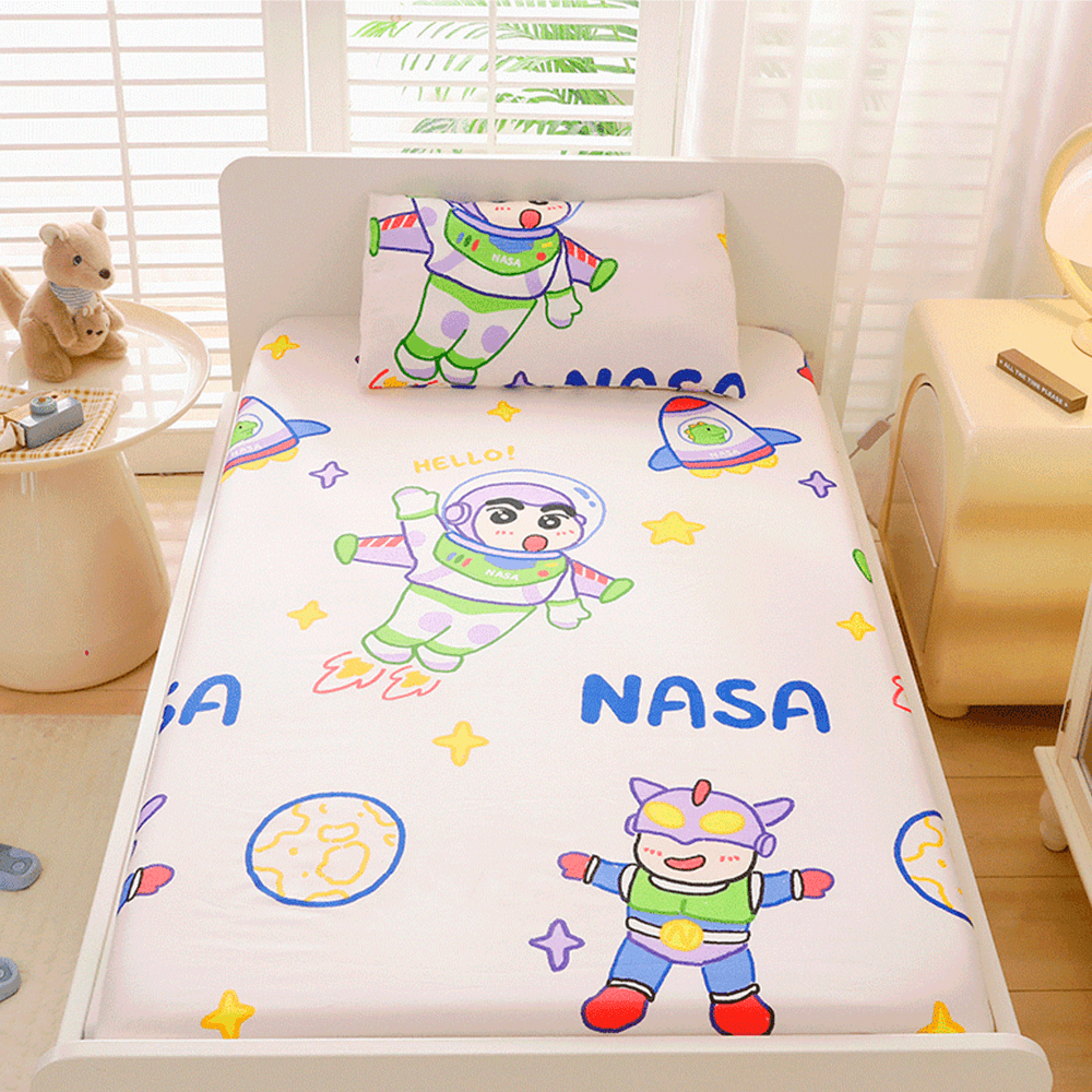 Babelio crib mattress with playful cartoon astronaut pattern in a bright nursery