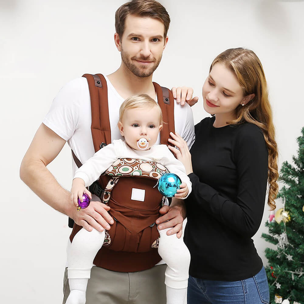Babelio baby carrier with family, ergonomic infant and toddler sling in living room