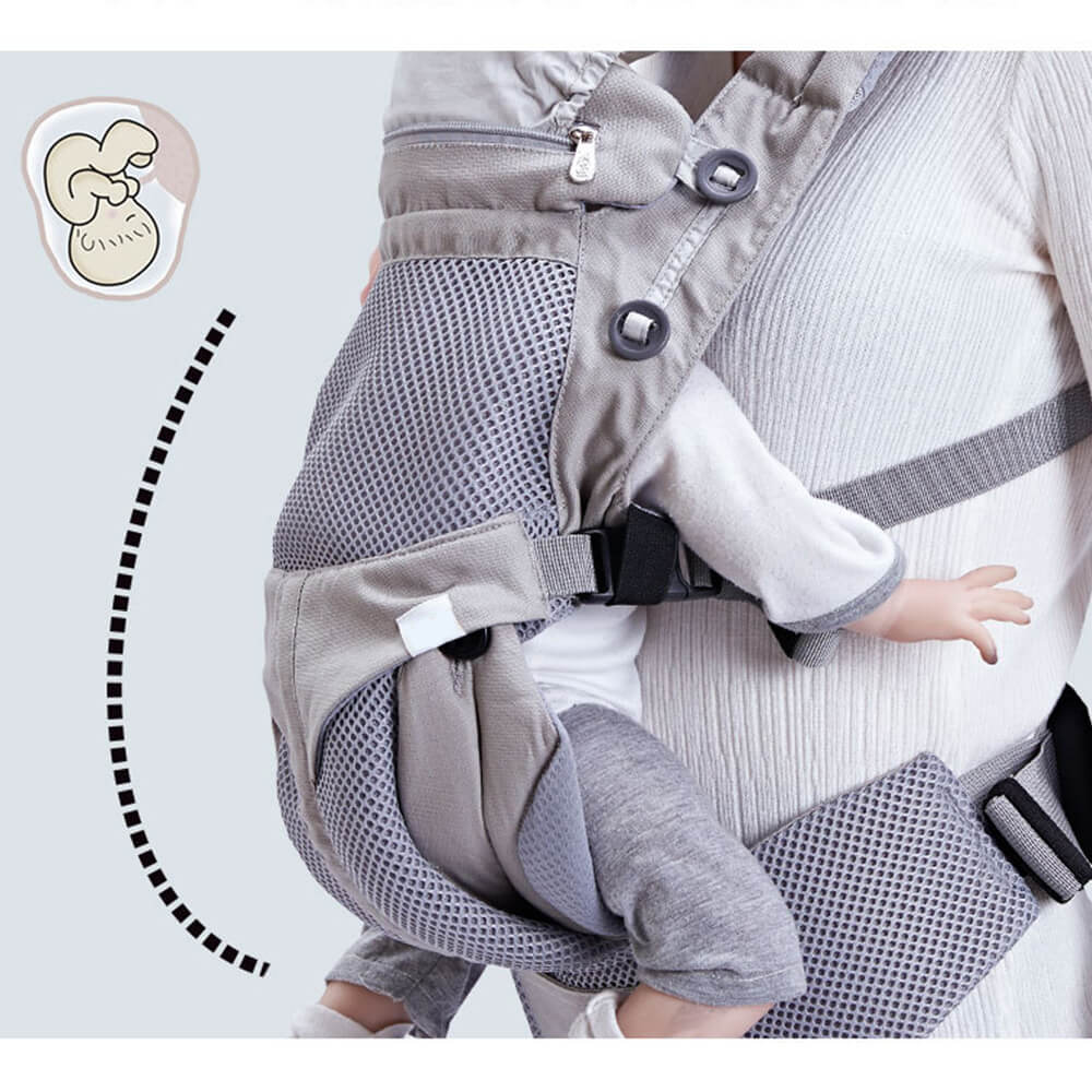 Babelio ergonomic baby carrier sling worn by parent, grey mesh design, in a home setting