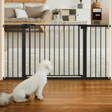 Babelio black baby safety gate installed in a living room doorway, white dog sitting in front