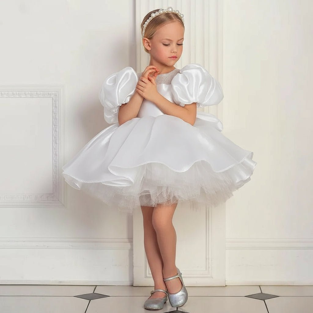 Young girl in a white Flower dress with puffed sleeves