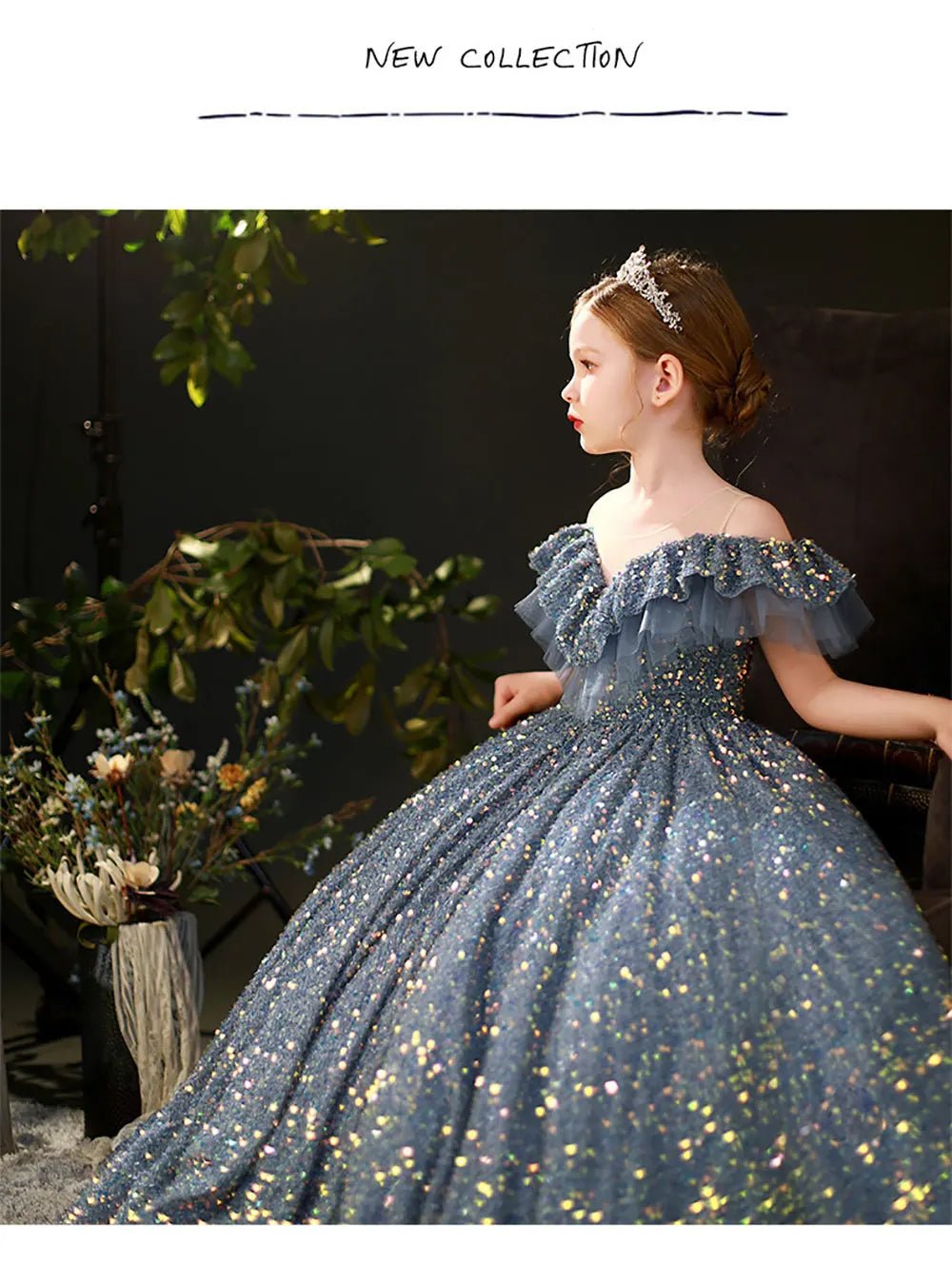 Babelio elegant little girl in a sparkly blue gown and tiara, seated indoors with floral decor