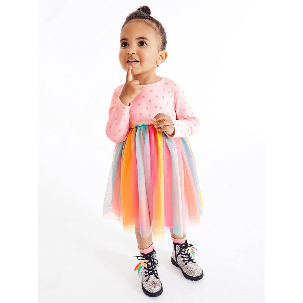 Toddler girl in rainbow tulle dress and sparkly boots, Babelio baby fashion, white background