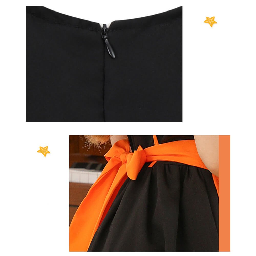 Babelio black dress with orange bow detail, close-up of fabric and zipper