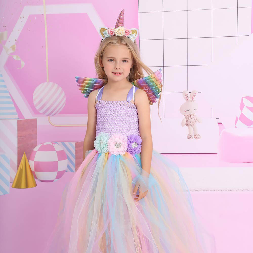 Babelio kids unicorn princess tulle dress with rainbow wings in a colorful playroom
